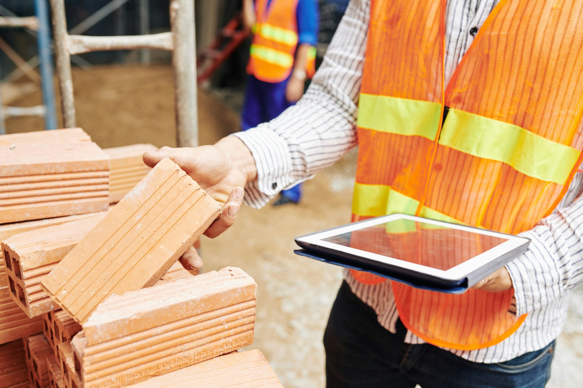 Construction engineer checking building materials